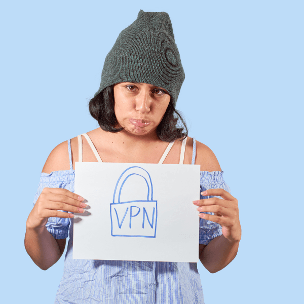 a woman standing with a piece of paper with "VPN" written on it, it symbolises the concept of VPN