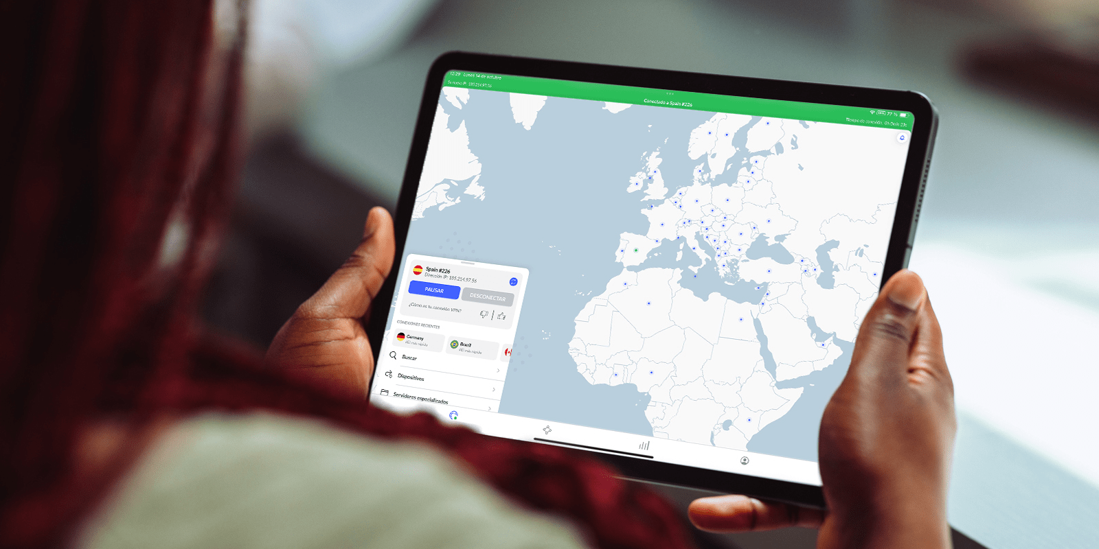 Woman using NordVPN on a tablet